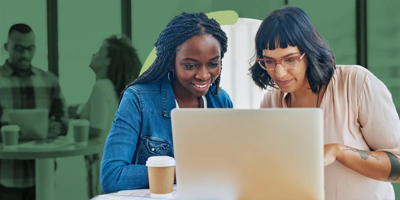 Two nonprofit professionals collaborating on a grant application